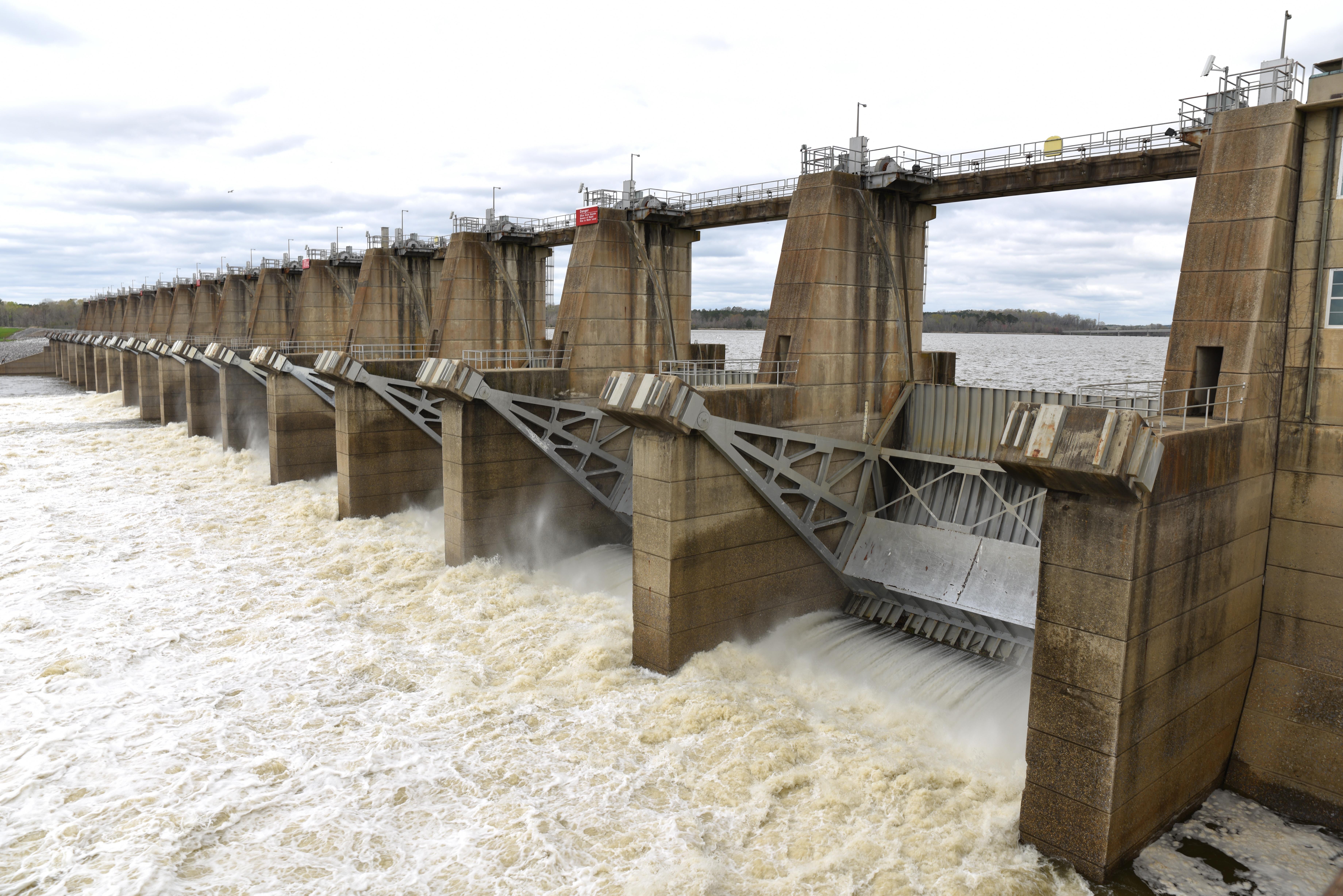 Image shows Millers Ferry Dam's hydroelectric turbines and water flowing from the upper reservoir to the lower river.
