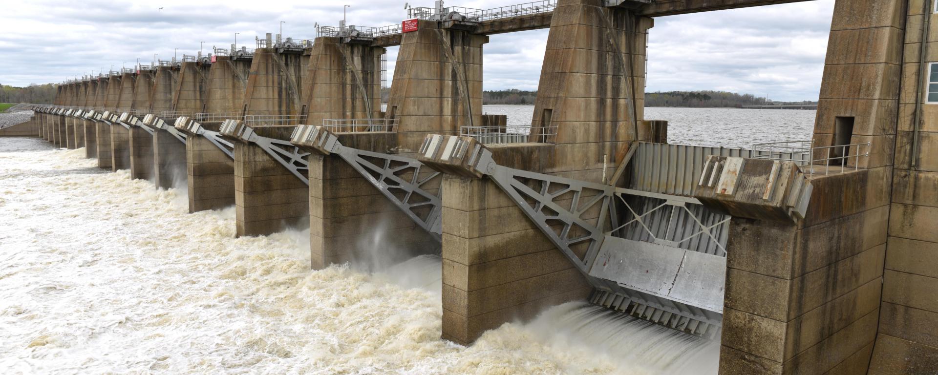 Image shows Millers Ferry Dam's hydroelectric turbines and water flowing from the upper reservoir to the lower river.